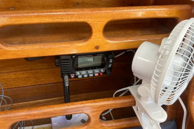 Slide: The Image of Wooden interior of a 1974 Ericson 32-2 sailboat with radio and fan. - 20
