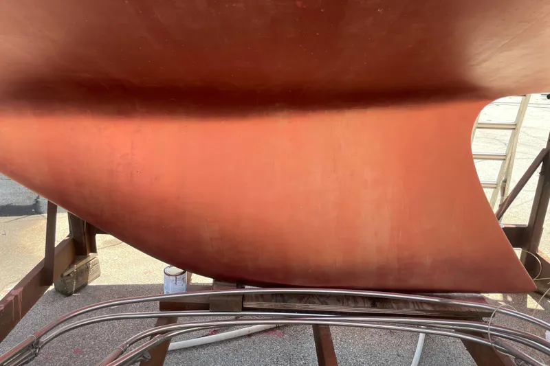 Slide: The Image of Close-up of a 1974 Ericson 32-2 sailboat hull in dry dock. - 8