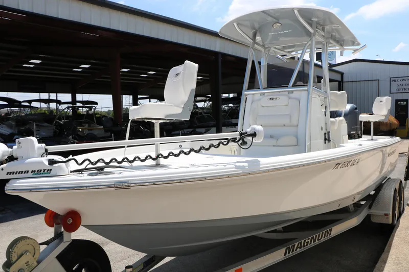 Slide: The Image of 2016 Sea Hunt BX 22 BR boat on trailer, equipped with Minn Kota trolling motor. - 16