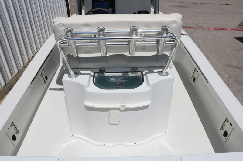 Slide: The Image of 2016 Sea Hunt BX 22 BR boat interior with rod holders and seating. - 21