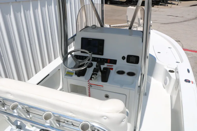 Slide: The Image of 2016 Sea Hunt BX 22 BR boat interior with steering console and seating. - 22