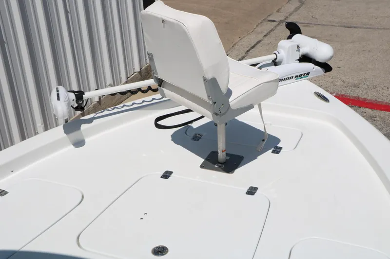 Slide: The Image of 2016 Sea Hunt BX 22 BR boat deck with white seat and trolling motor. - 25