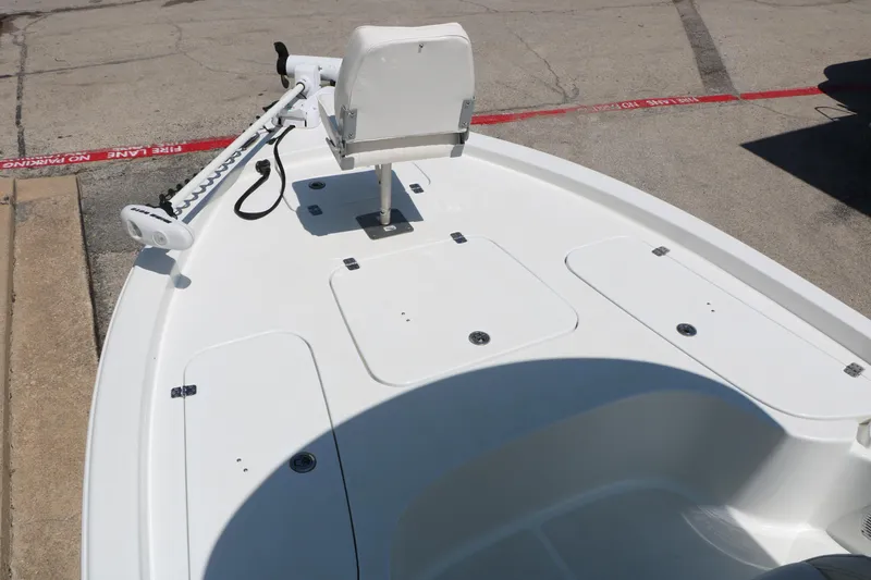 Slide: The Image of 2016 Sea Hunt BX 22 BR boat deck with trolling motor and storage compartments. - 28