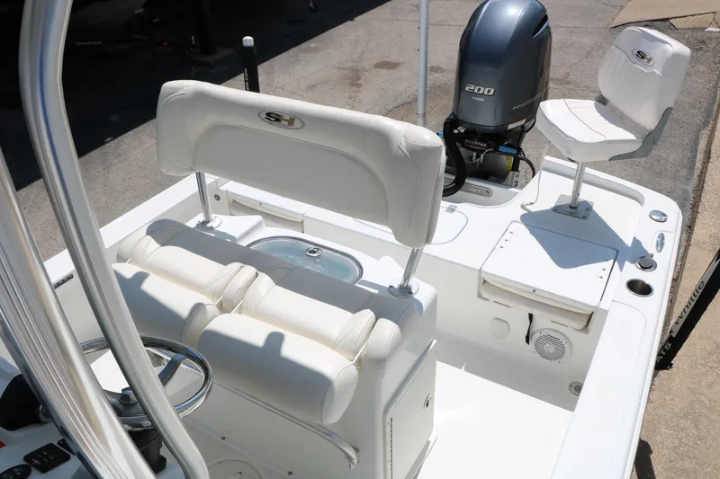 Slide: The Image of 2016 Sea Hunt BX 22 BR boat interior with seating and Yamaha 200 engine. - 30