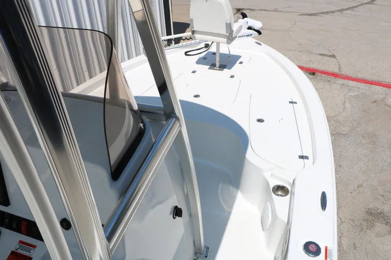 Slide: The Image of 2016 Sea Hunt BX 22 BR boat deck with console and seating area. - 35