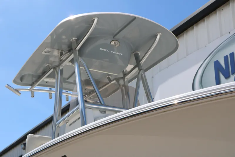 Slide: The Image of 2016 Sea Hunt BX 22 BR boat with T-top under clear blue sky. - 4