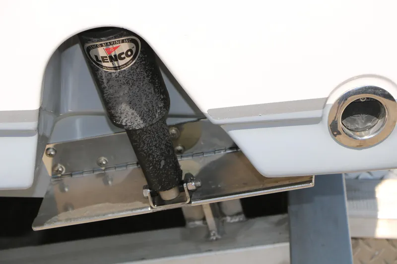 Slide: The Image of Close-up of a 2016 Sea Hunt BX 22 BR boat's Lenco trim tab system. - 55