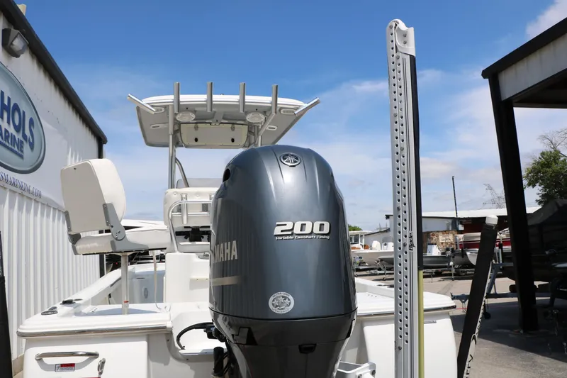 Slide: The Image of 2016 Sea Hunt BX 22 BR boat with Yamaha 200 engine at a marine dealership. - 8