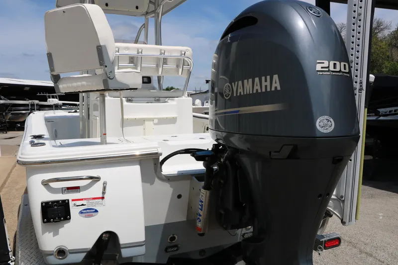 Slide: The Image of 2016 Sea Hunt BX 22 BR boat with Yamaha 200 engine, docked outdoors. - 9