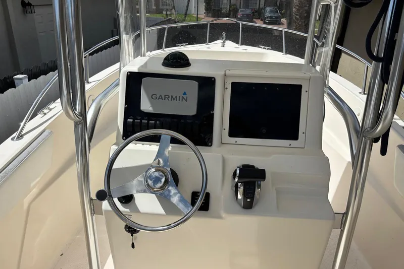 Slide: The Image of 2004 Key West 2220 Center Console boat dashboard with Garmin navigation system. - 10