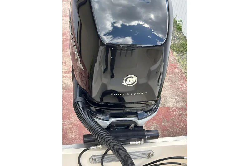 Slide: The Image of Outboard motor on a 2004 Key West 2220 Center Console boat, featuring a four-stroke engine. - 14