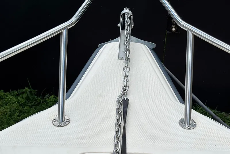 Slide: The Image of Bow of 2004 Key West 2220 Center Console with anchor chain and railing. - 9