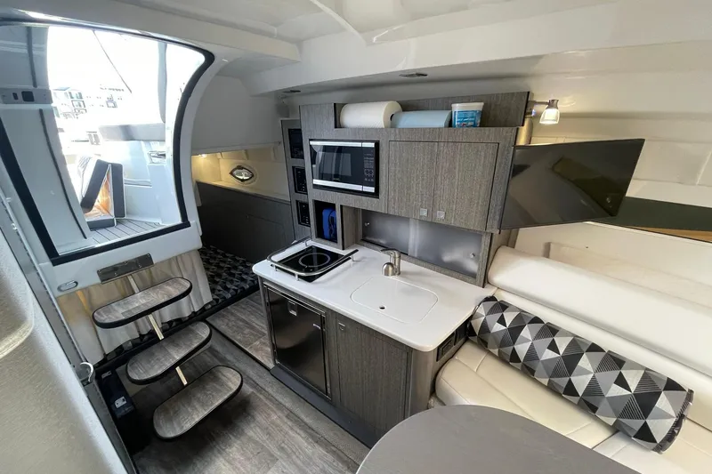 Slide: The Image of GALLEY OVERVIEW LOOKING AFT TO CABIN ENTRANCEWAY W/FLOATING STEPS, & AFT CABIN - 16