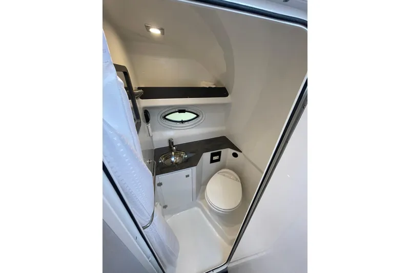 Slide: The Image of HEAD TO STBD. OVERVIEW WITH VANITY SINK, ELECTRIC FRESH WATER HEAD, & SHOWER - 23
