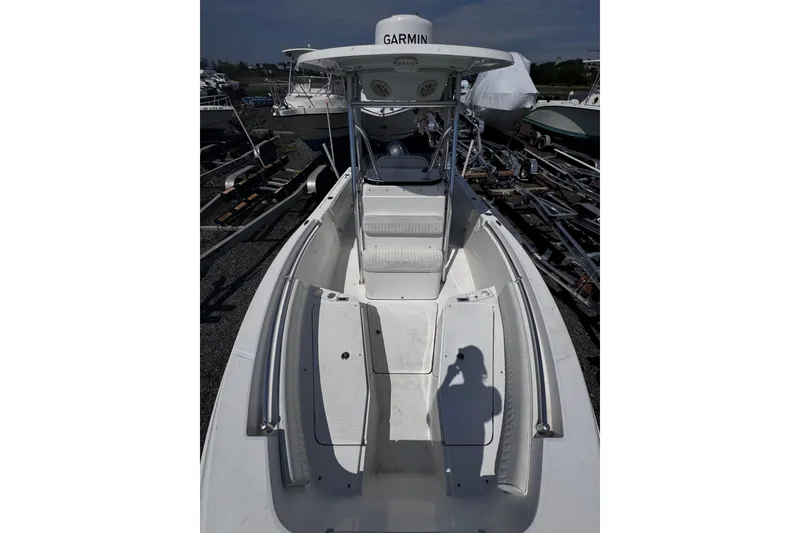 Slide: The Image of 2017 Release 210RX boat with Garmin equipment, docked and ready for use. - 18