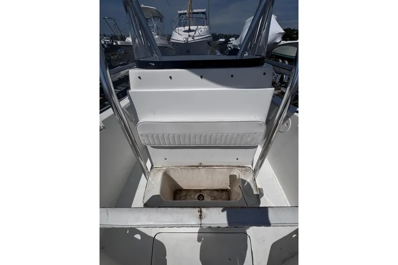 Slide: The Image of 2017 Release 210RX boat interior with storage compartment and seating area. - 24