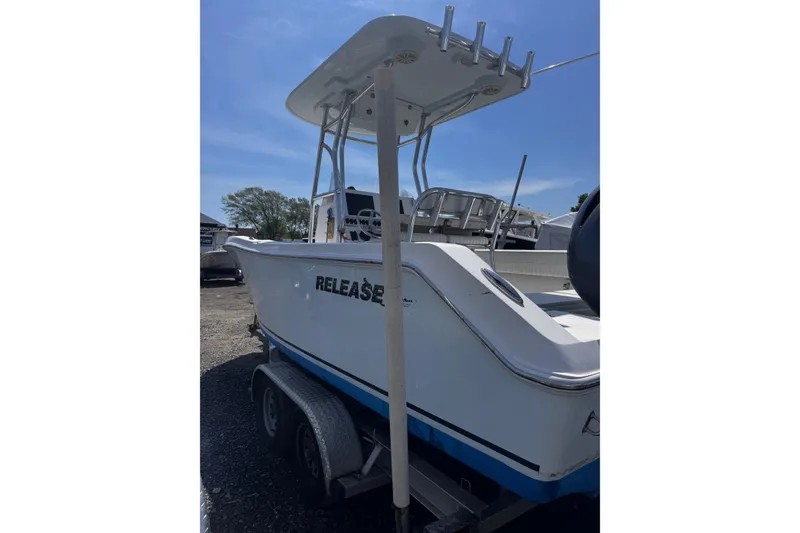 Slide: The Image of 2017 Release 210RX boat on trailer under clear blue sky. - 7