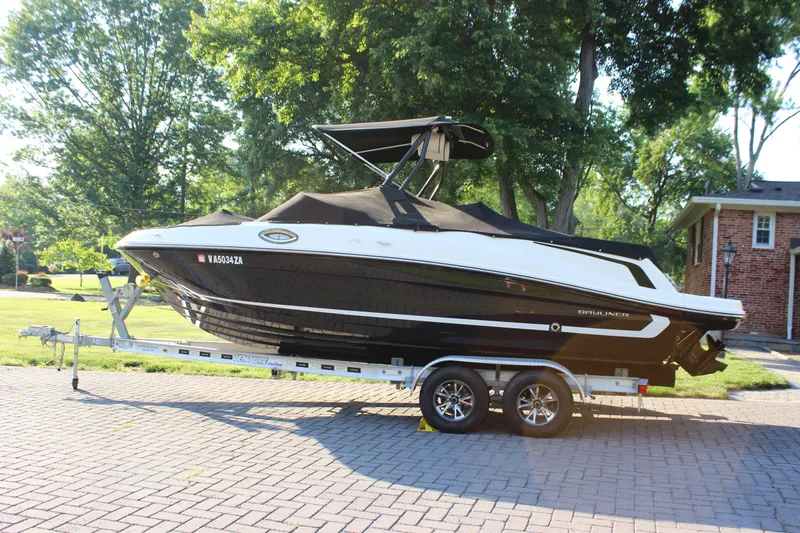The Image of 2020 Bayliner VR6 Bowrider I/O on trailer, parked in a sunny residential area. - 0