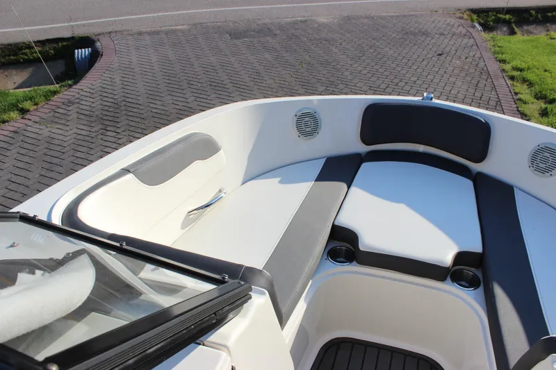 Slide: The Image of 2020 Bayliner VR6 Bowrider I/O boat interior with cushioned seating and cup holders. - 10