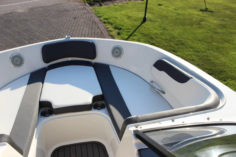 Slide: The Image of 2020 Bayliner VR6 Bowrider I/O boat interior with cushioned seating and cup holders. - 11