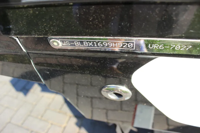 Slide: The Image of 2020 Bayliner VR6 Bowrider I/O hull identification number on black surface. - 26