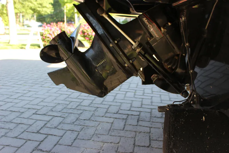 Slide: The Image of 2020 Bayliner VR6 Bowrider I/O outboard motor on a paved surface. - 5