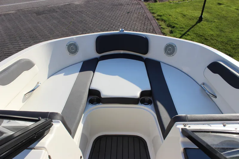 Slide: The Image of 2020 Bayliner VR6 Bowrider I/O interior with cushioned seating and cup holders. - 9