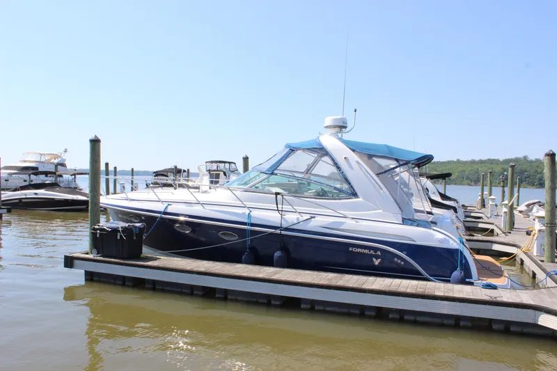 Slide: The Image of 2005 Formula 31 Performance Cruiser docked at marina on a sunny day. - 10