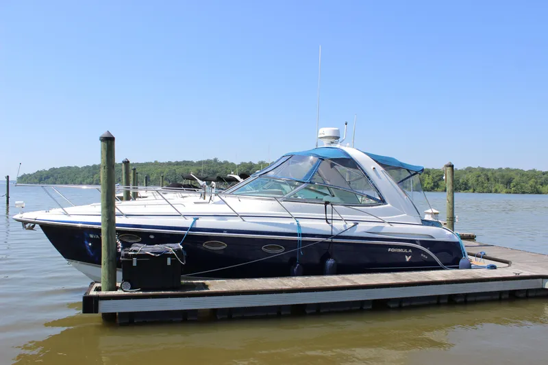 Slide: The Image of 2005 Formula 31 Performance Cruiser docked on a sunny day. - 11