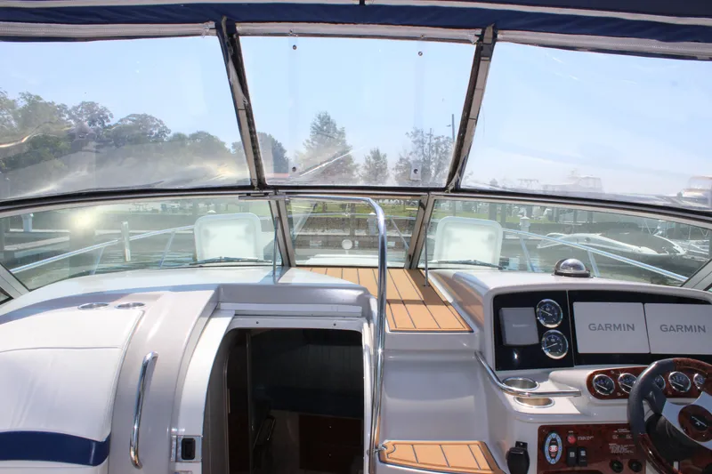 Slide: The Image of 2005 Formula 31 Performance Cruiser cockpit with Garmin navigation displays. - 12
