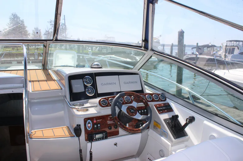 Slide: The Image of 2005 Formula 31 Performance Cruiser helm with Garmin navigation, docked at marina. - 13