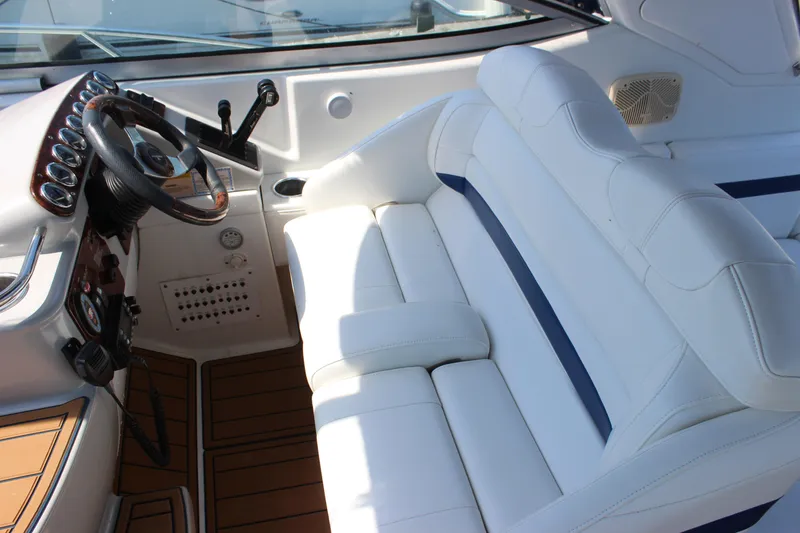 Slide: The Image of 2005 Formula 31 Performance Cruiser cockpit with white seating and steering wheel. - 15