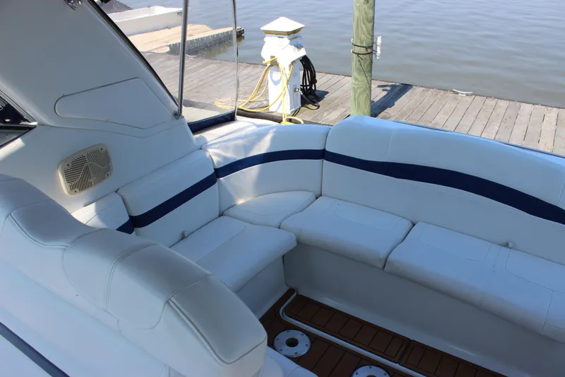 Slide: The Image of 2005 Formula 31 Performance Cruiser interior with white seating and dockside view. - 16