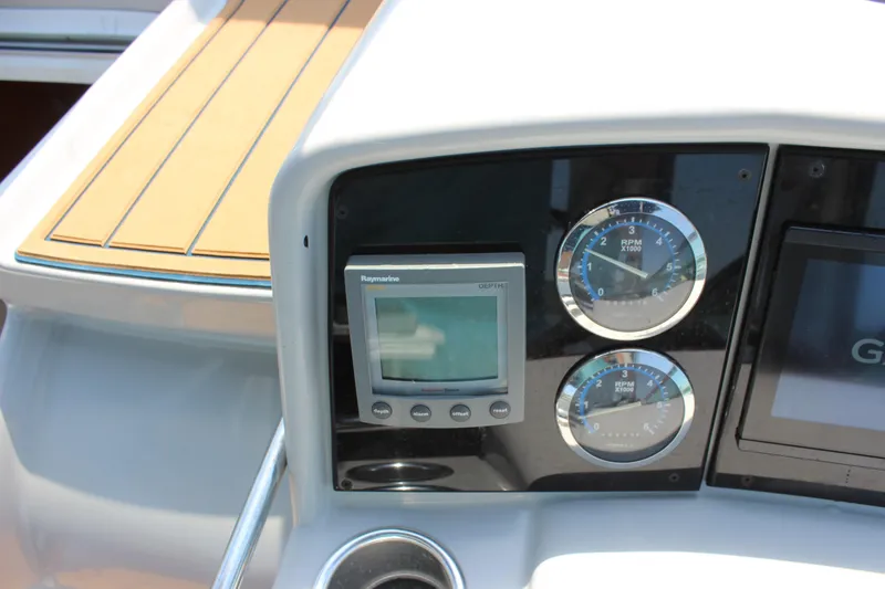 Slide: The Image of Dashboard of 2005 Formula 31 Performance Cruiser with gauges and Raymarine display. - 19