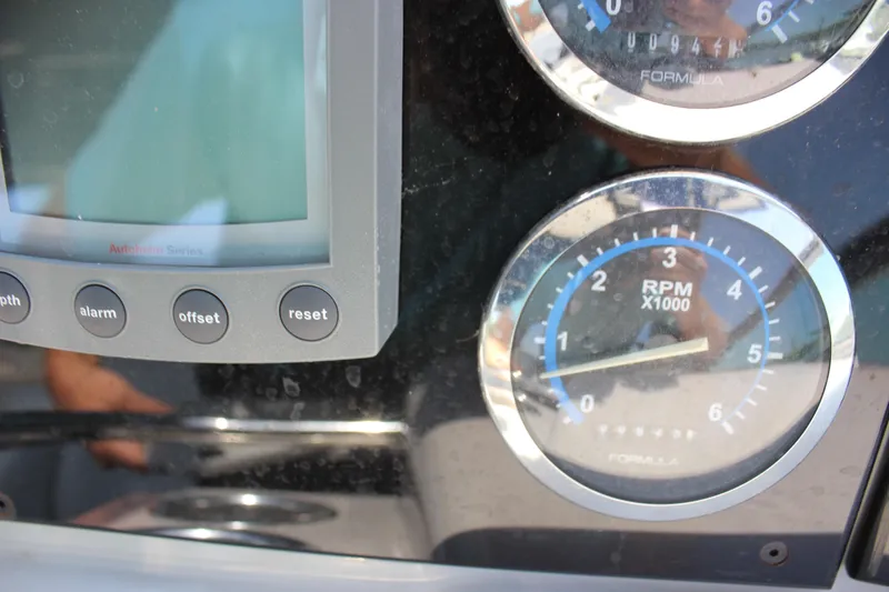 Slide: The Image of Close-up of 2005 Formula 31 Performance Cruiser dashboard with RPM gauge and control panel. - 21