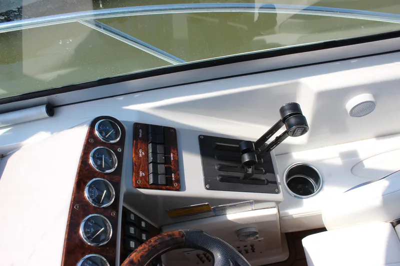 Slide: The Image of 2005 Formula 31 Performance Cruiser dashboard with controls and gauges. - 24