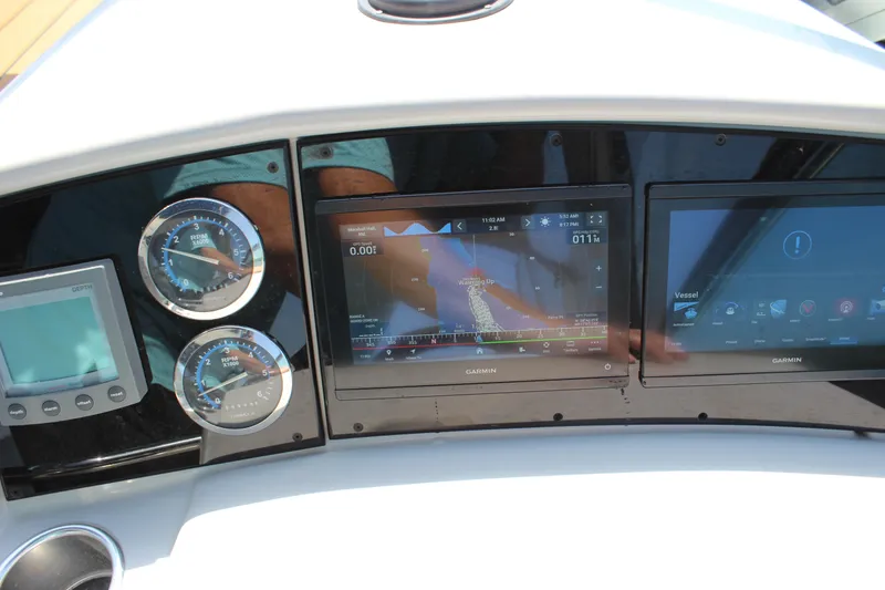 Slide: The Image of Dashboard of a 2005 Formula 31 Performance Cruiser with Garmin navigation displays. - 25