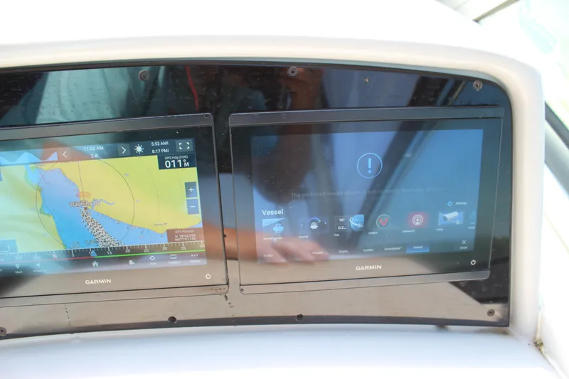 Slide: The Image of Garmin navigation screens on a 2005 Formula 31 Performance Cruiser boat dashboard. - 26
