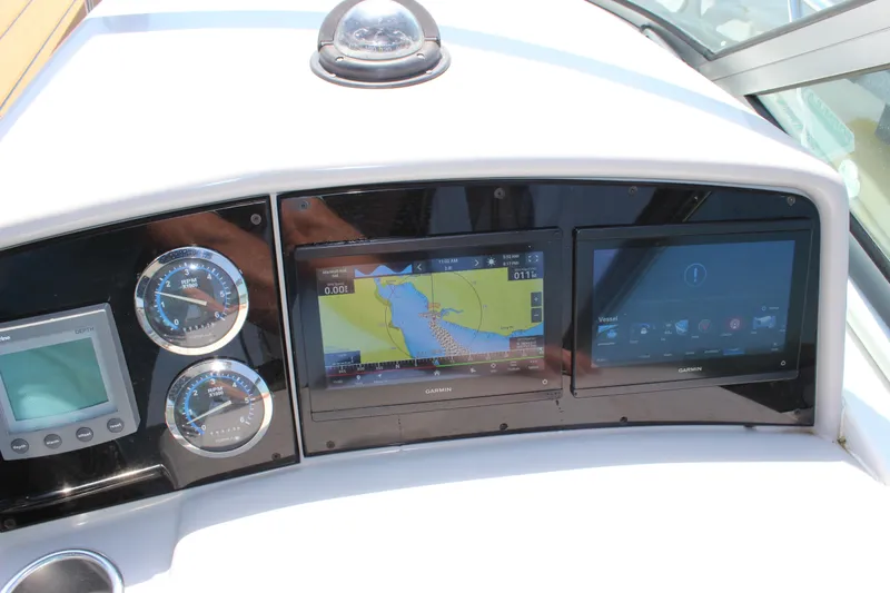 Slide: The Image of Dashboard of a 2005 Formula 31 Performance Cruiser with navigation and control displays. - 27