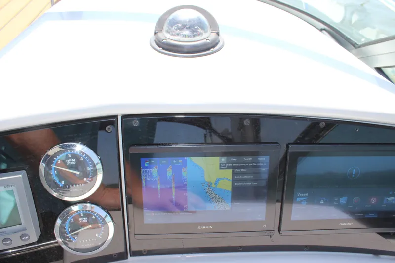 Slide: The Image of Dashboard of a 2005 Formula 31 Performance Cruiser with navigation displays and gauges. - 37