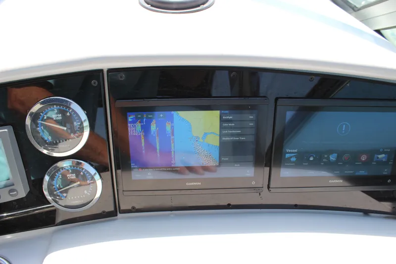 Slide: The Image of Dashboard of a 2005 Formula 31 Performance Cruiser with Garmin navigation displays. - 38