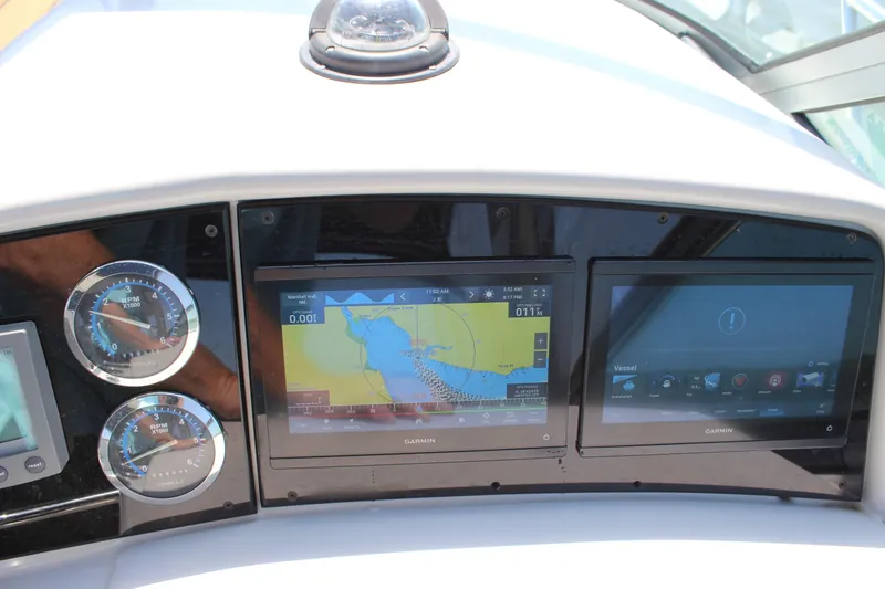 Slide: The Image of Dashboard of a 2005 Formula 31 Performance Cruiser with Garmin navigation displays. - 39