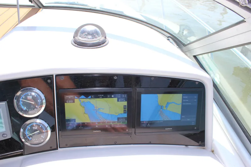 Slide: The Image of Dashboard of a 2005 Formula 31 Performance Cruiser with navigation screens and gauges. - 41