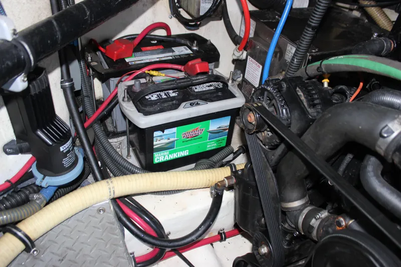 Slide: The Image of Engine compartment of a 2005 Formula 31 Performance Cruiser with marine battery and wiring. - 44