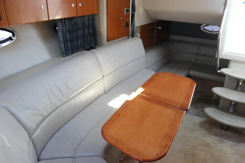 Slide: The Image of Interior of 2005 Formula 31 Performance Cruiser with leather seating and wooden table. - 54