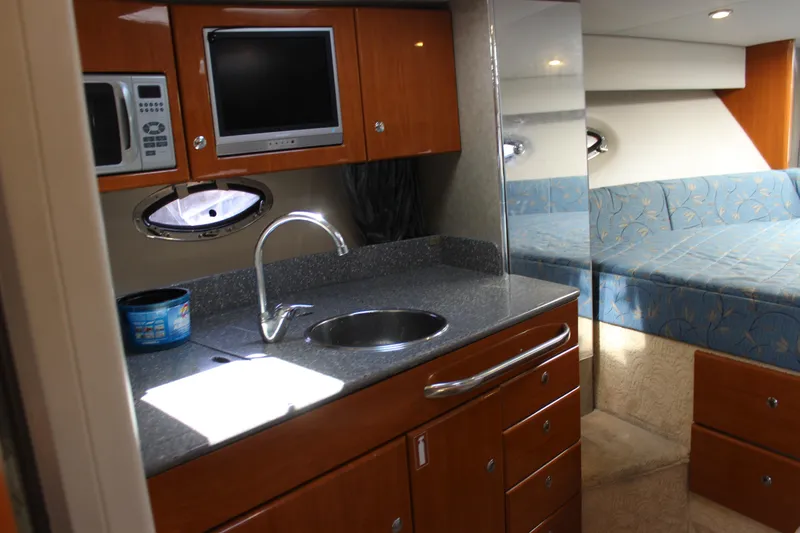 Slide: The Image of 2005 Formula 31 Performance Cruiser interior with kitchenette and cozy seating area. - 55