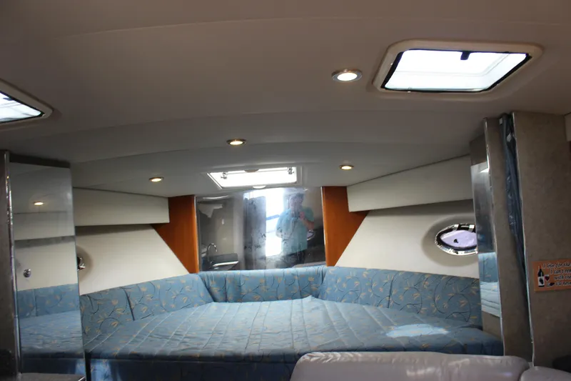 Slide: The Image of Interior of 2005 Formula 31 Performance Cruiser with blue seating and overhead lighting. - 59