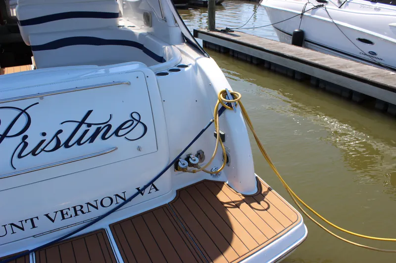 Slide: The Image of 2005 Formula 31 Performance Cruiser docked, featuring elegant deck and mooring lines. - 7
