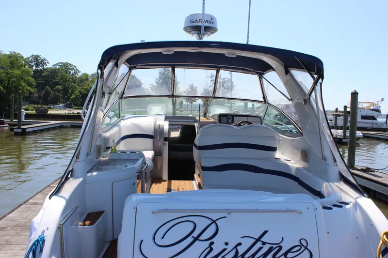 Slide: The Image of 2005 Formula 31 Performance Cruiser docked, featuring spacious cockpit and Garmin navigation system. - 8
