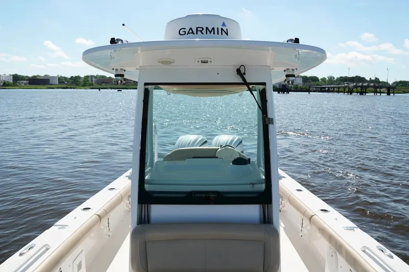 Slide: The Image of 2019 Everglades 273 Center Console boat on water, featuring Garmin equipment. - 18